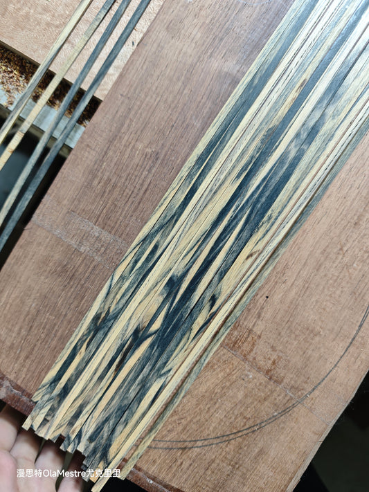 Black and white ebony wood guitar binding